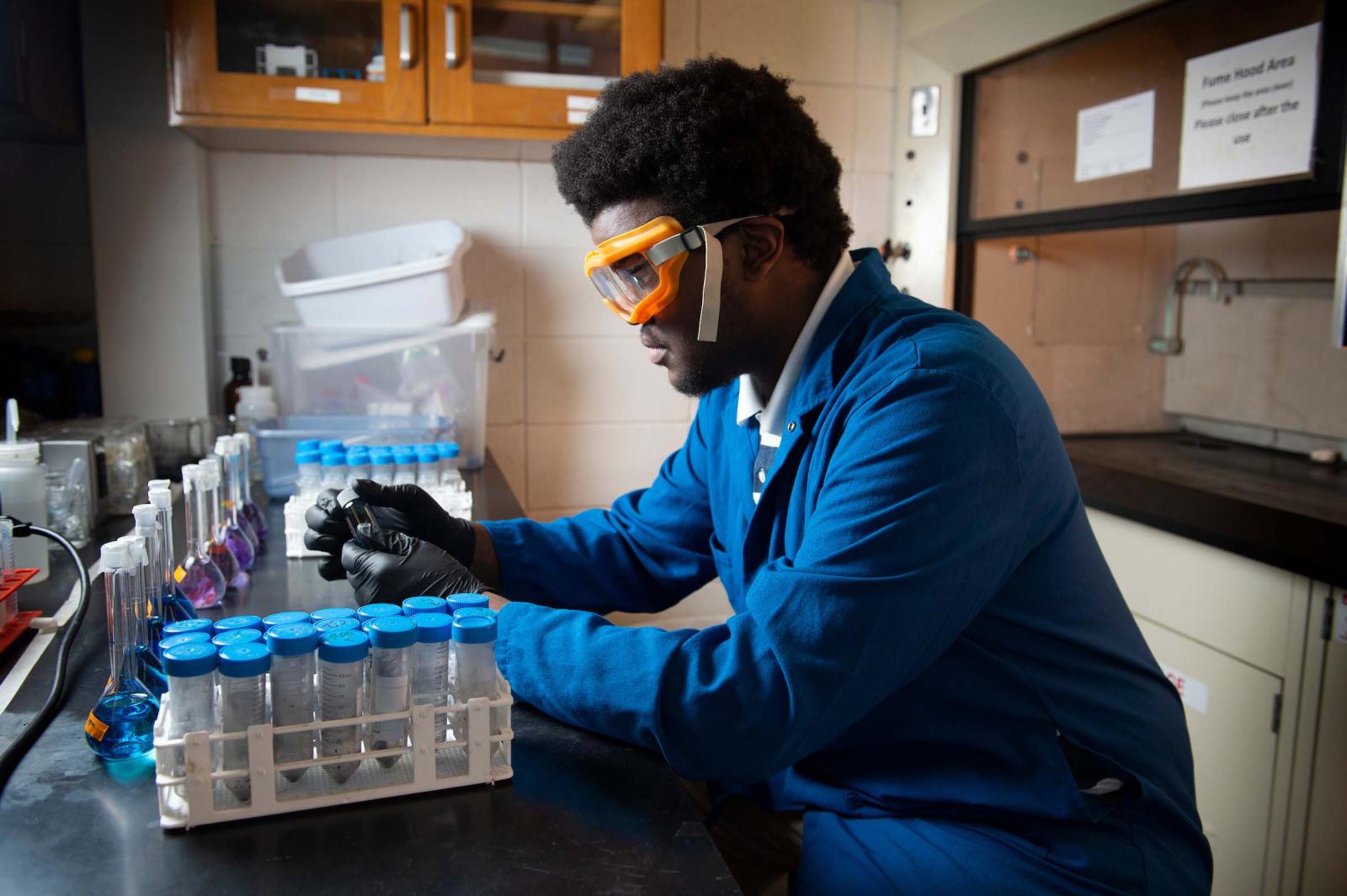 Caleb James researching chemicals in the Chemistry Lab at MSU